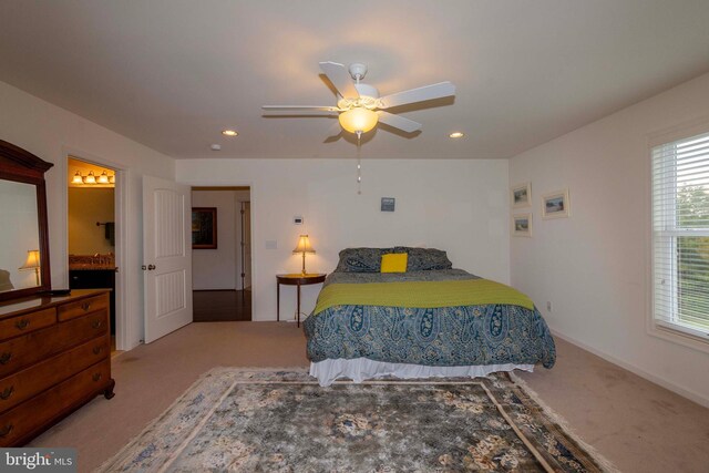 carpeted bedroom with ceiling fan