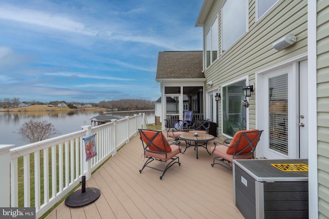 wooden deck with a water view