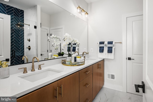 bathroom featuring a shower and vanity