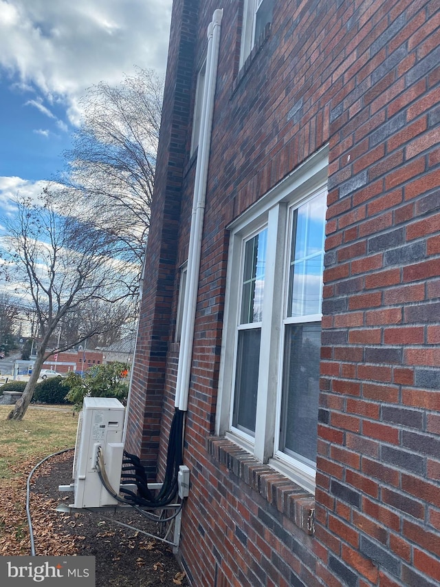 view of side of property featuring ac unit