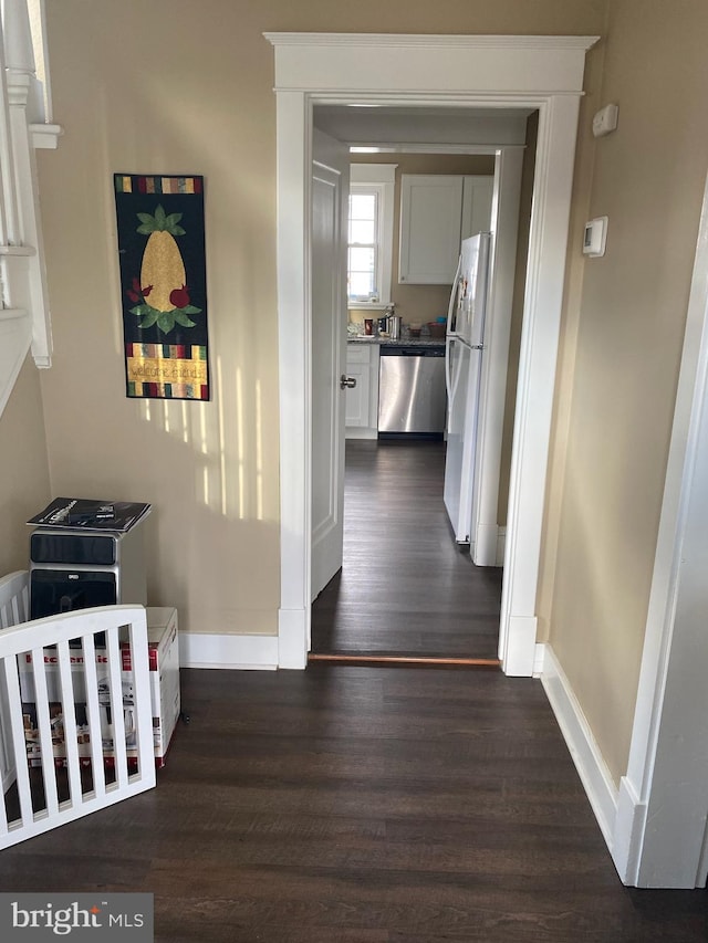 hallway featuring dark hardwood / wood-style flooring