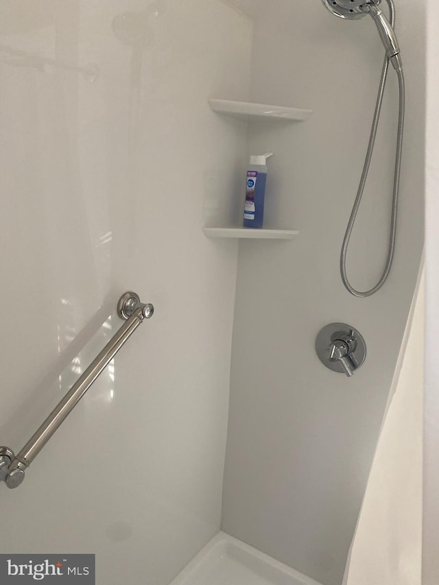 bathroom featuring walk in shower