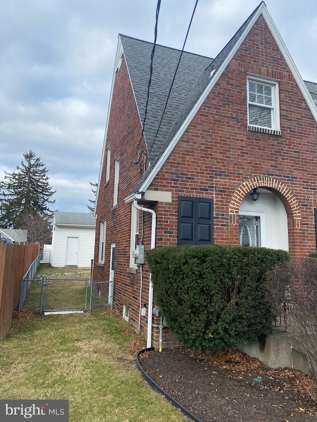 view of home's exterior with a lawn