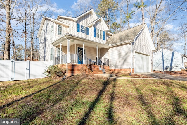 traditional-style home with a front yard, a gate, fence, driveway, and a porch