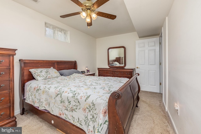 bedroom with light colored carpet, baseboards, and ceiling fan