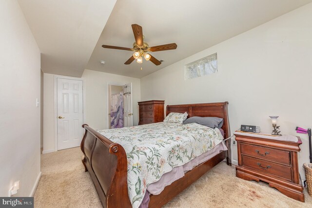 bedroom with baseboards, light colored carpet, and ceiling fan