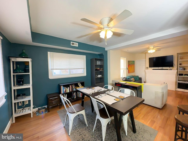 dining room featuring ceiling fan and light hardwood / wood-style floors