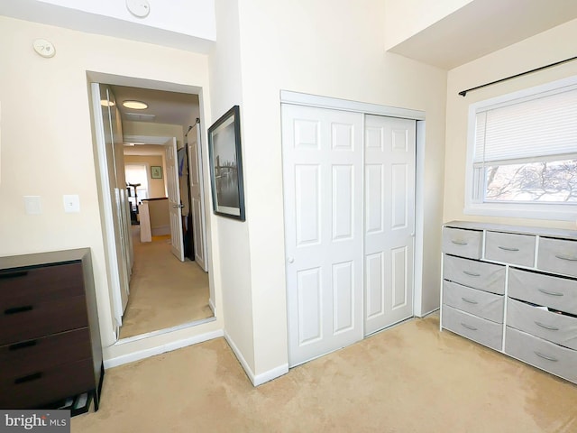 carpeted bedroom featuring a closet