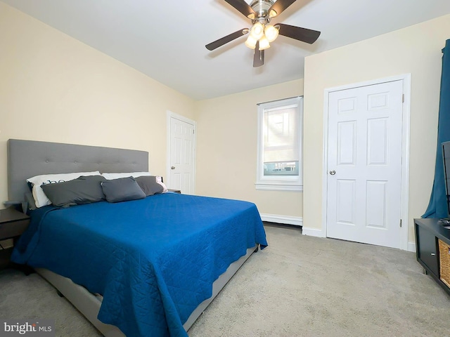 carpeted bedroom featuring ceiling fan