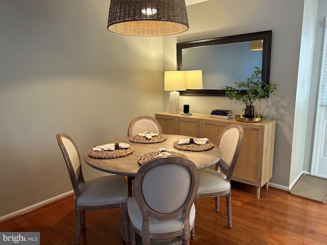 dining room with hardwood / wood-style flooring