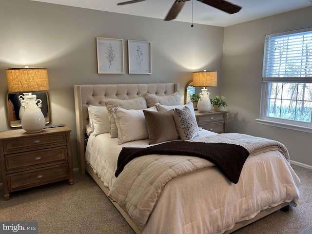 bedroom featuring light carpet and ceiling fan