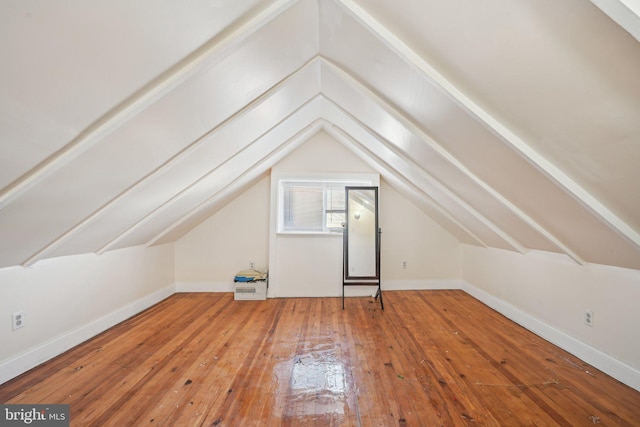 bonus room featuring lofted ceiling and hardwood / wood-style floors