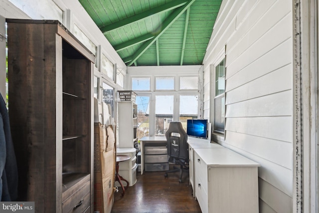 unfurnished office with wood ceiling, dark hardwood / wood-style floors, lofted ceiling with beams, and wood walls