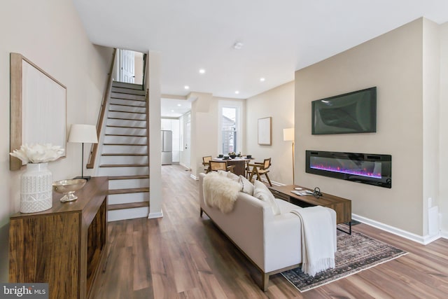 living room with dark hardwood / wood-style flooring