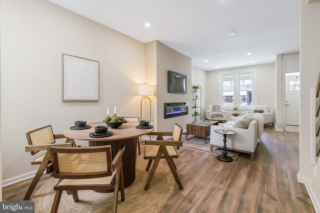 living room with dark hardwood / wood-style flooring