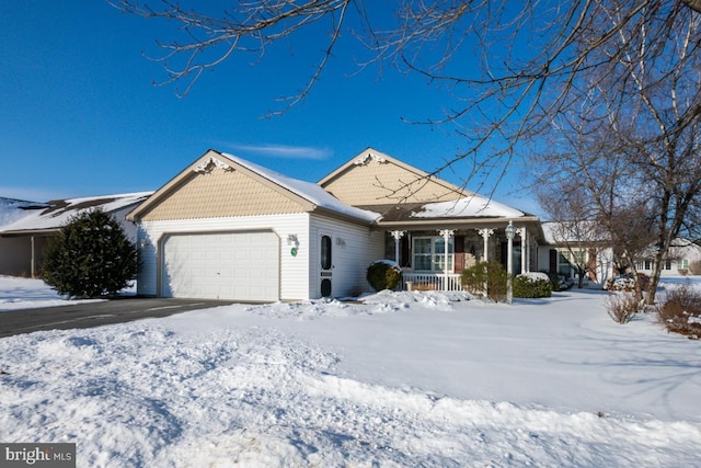 view of front facade with a garage and covered porch