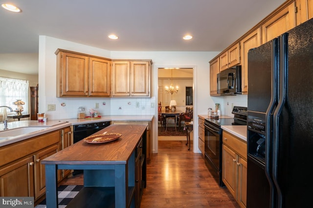 kitchen with sink, wooden counters, backsplash, black appliances, and dark hardwood / wood-style flooring