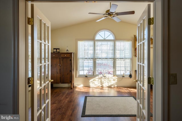 interior space with french doors, ceiling fan, lofted ceiling, and dark hardwood / wood-style floors