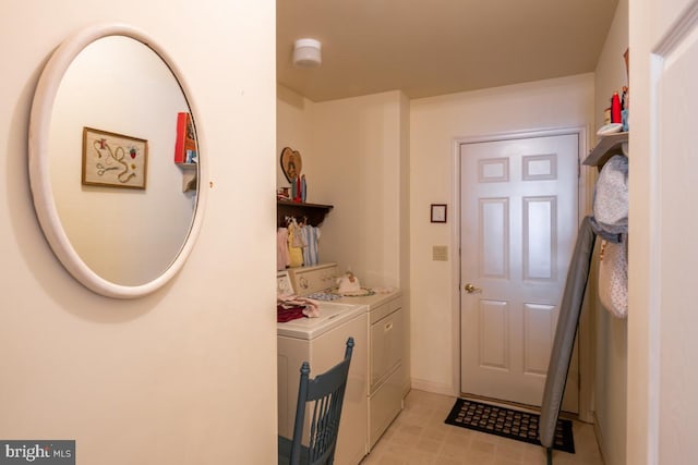 clothes washing area featuring washing machine and clothes dryer