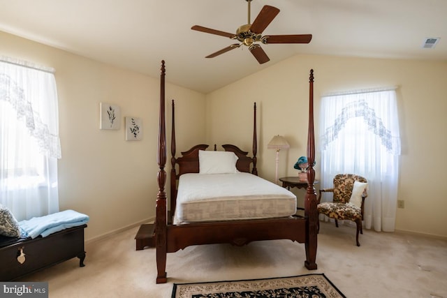 bedroom with lofted ceiling, light carpet, and ceiling fan