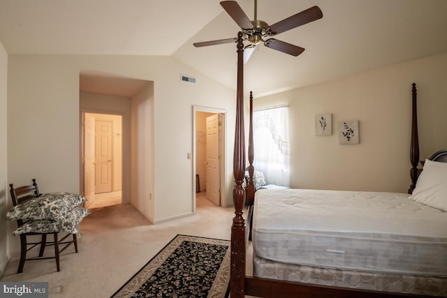 bedroom with ceiling fan, vaulted ceiling, and light carpet