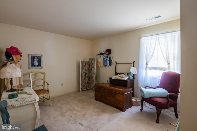 living area with light colored carpet