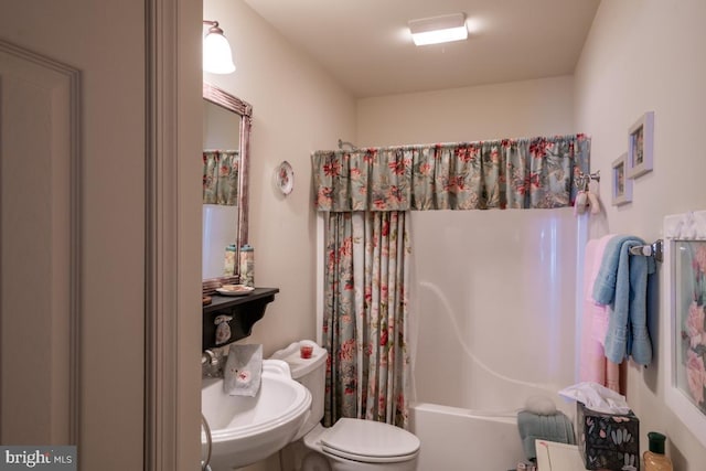 full bathroom featuring shower / tub combo, sink, and toilet