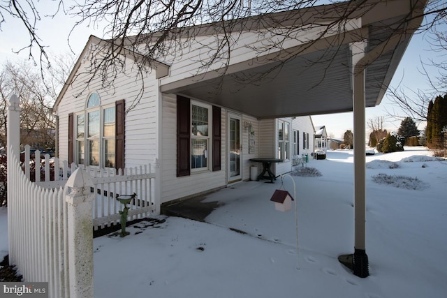 view of snow covered property