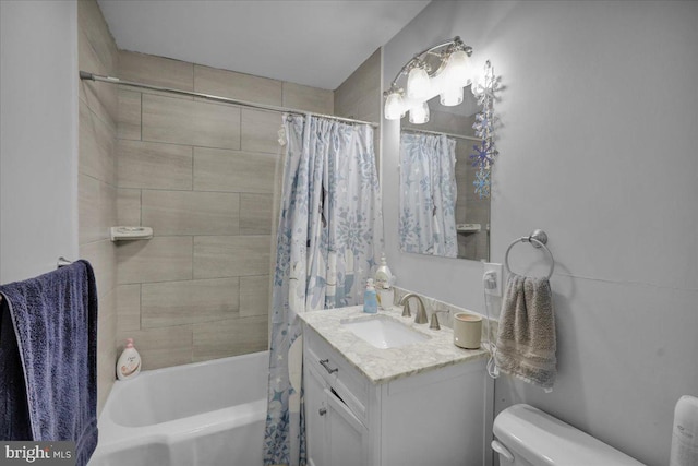 full bathroom with shower / bath combination with curtain, vanity, and toilet