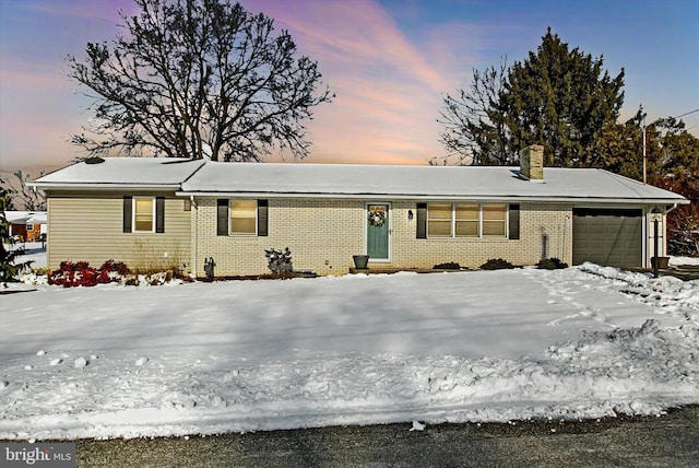 ranch-style home featuring a garage