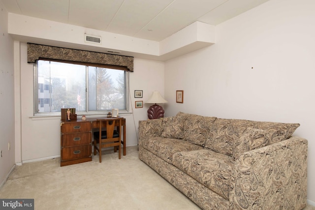 living room featuring light colored carpet