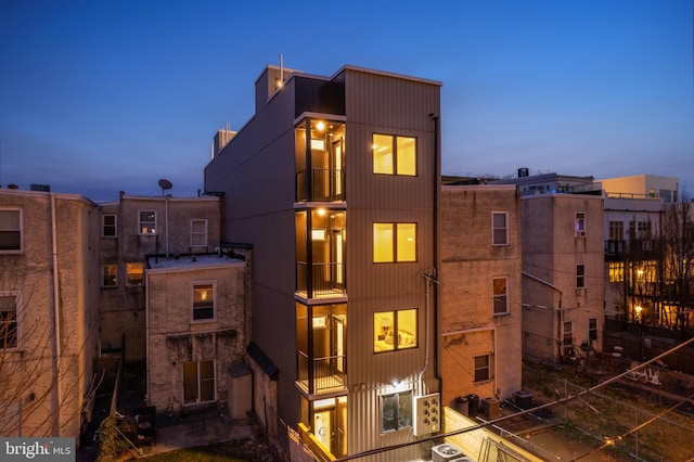 view of outdoor building at dusk