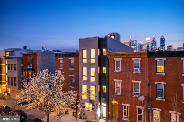 view of outdoor building at dusk