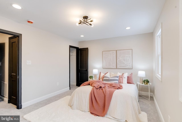 bedroom with light colored carpet