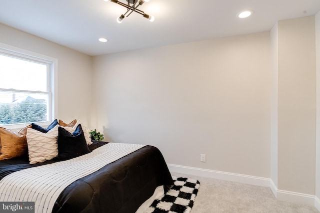 bedroom featuring light carpet