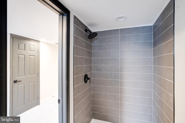 bathroom with tiled shower