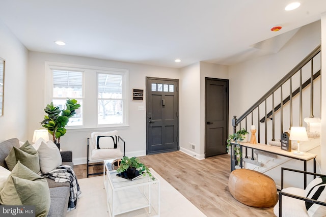 living room with light hardwood / wood-style flooring