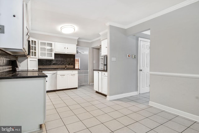 kitchen featuring light tile patterned flooring, dishwasher, white cabinets, decorative backsplash, and crown molding