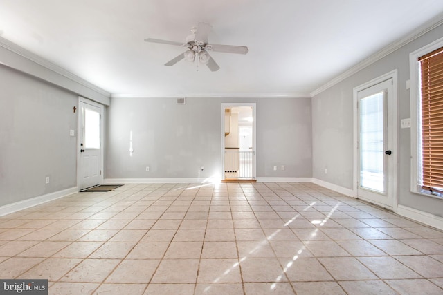 tiled spare room with ornamental molding and ceiling fan