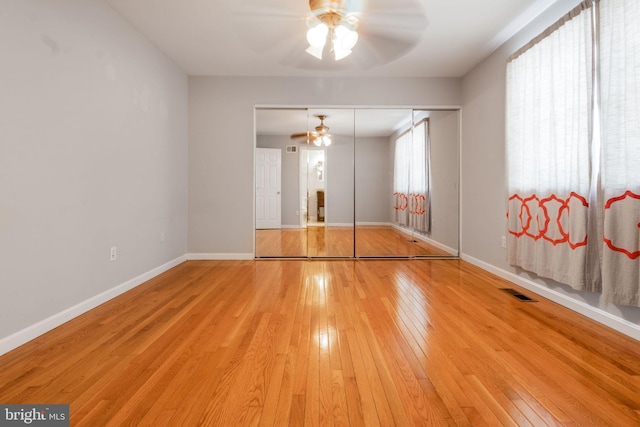 spare room featuring ceiling fan and wood-type flooring