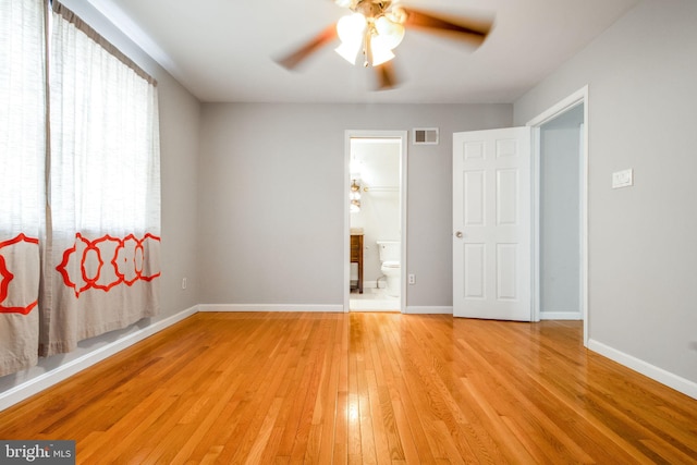 spare room featuring ceiling fan and light hardwood / wood-style floors