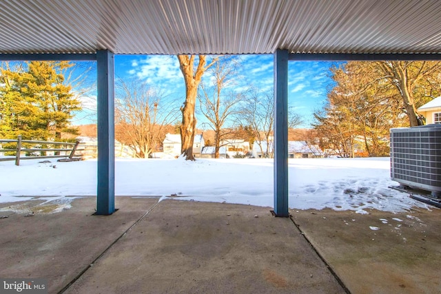 yard covered in snow with central air condition unit