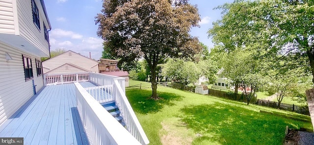 24625 Lunsford Ct, Damascus, MD 20872 - view of yard featuring a shed, a deck, and an outbuilding