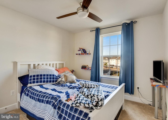 carpeted bedroom with ceiling fan