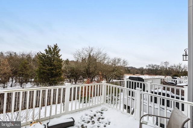 view of snow covered deck