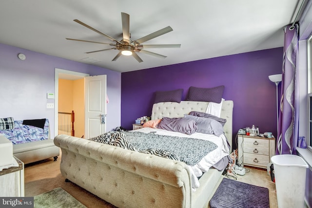 bedroom with ceiling fan and carpet