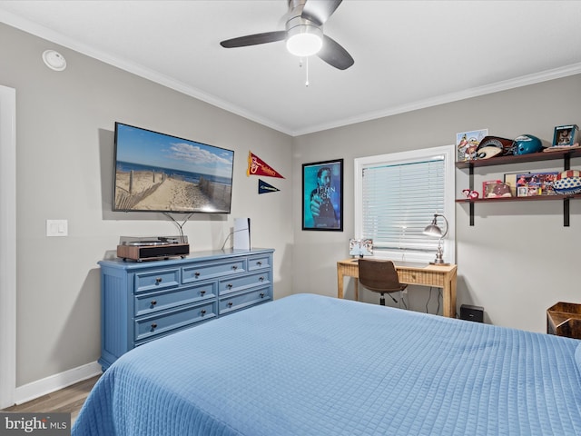 bedroom featuring ceiling fan, crown molding, and hardwood / wood-style floors