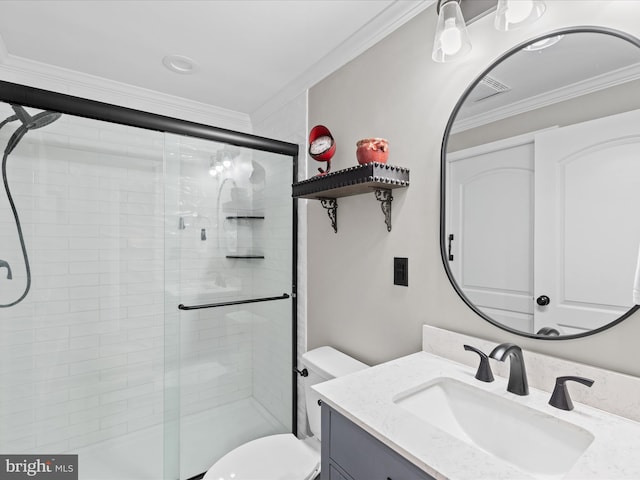 bathroom with vanity, a shower with shower door, ornamental molding, and toilet