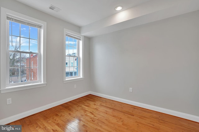 spare room featuring light hardwood / wood-style floors