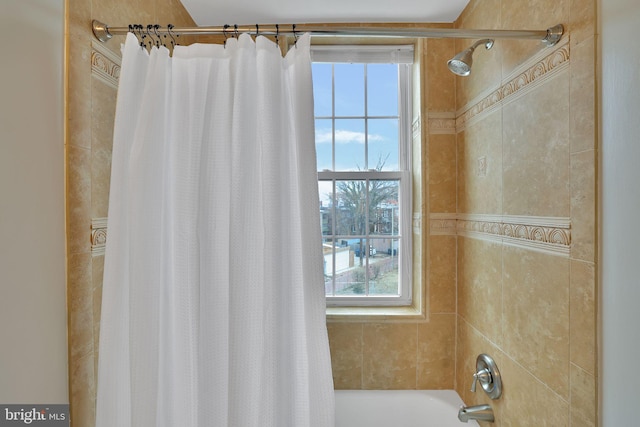 bathroom with shower / bath combination with curtain